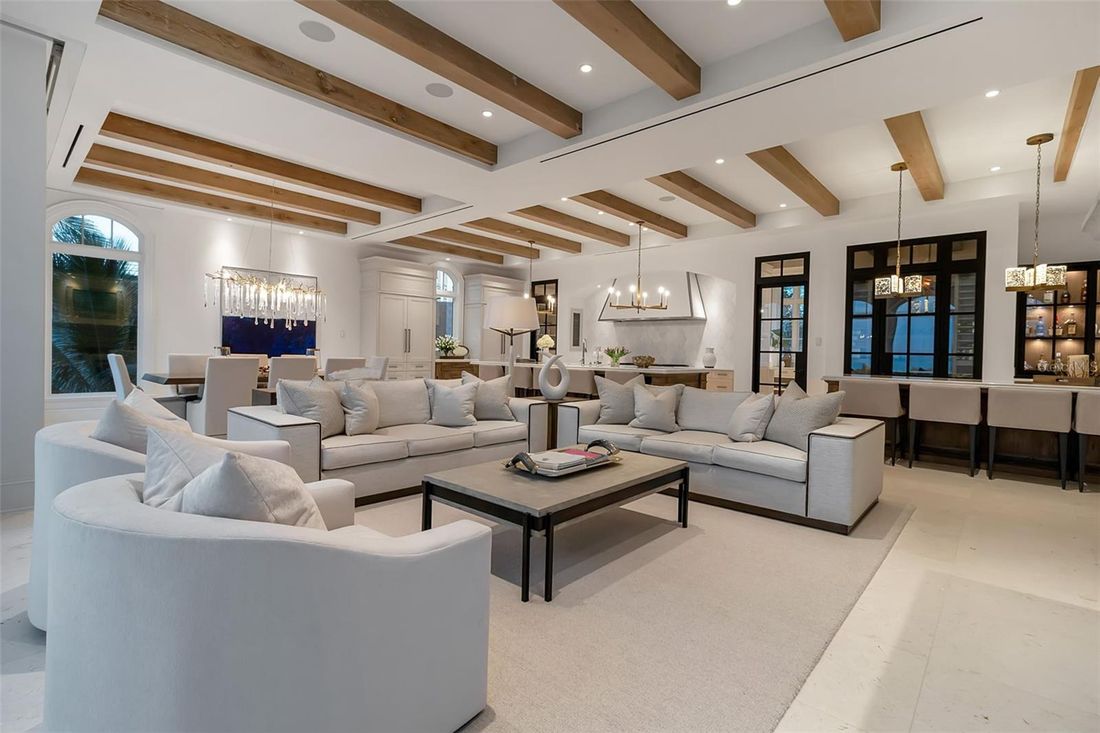 Great room beneath handcrafted wood beams