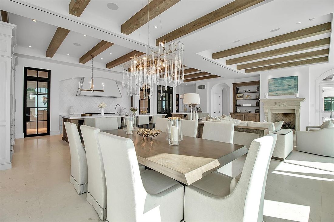 Formal dining room beneath a crystal chandelier