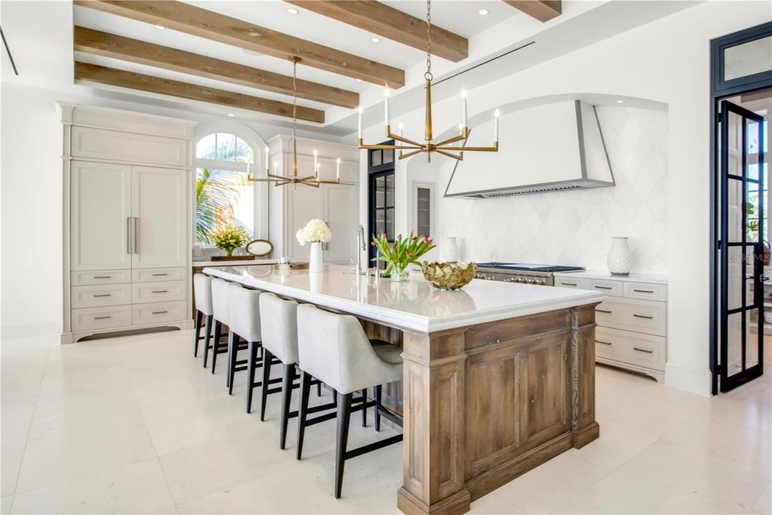 Chef's kitchen with an oversized island and seating