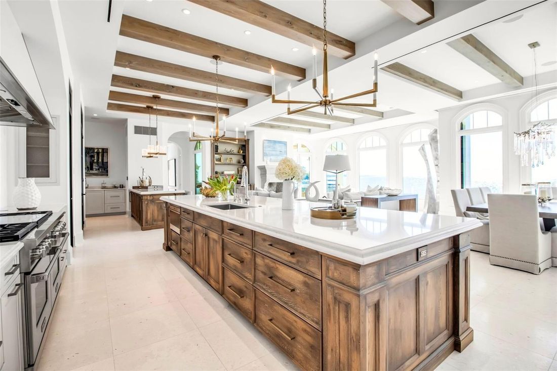 Wide view of the kitchen opening to the living spaces