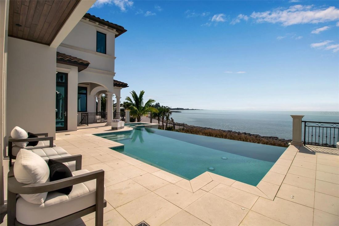 Infinity-edge pool meeting the Gulf horizon