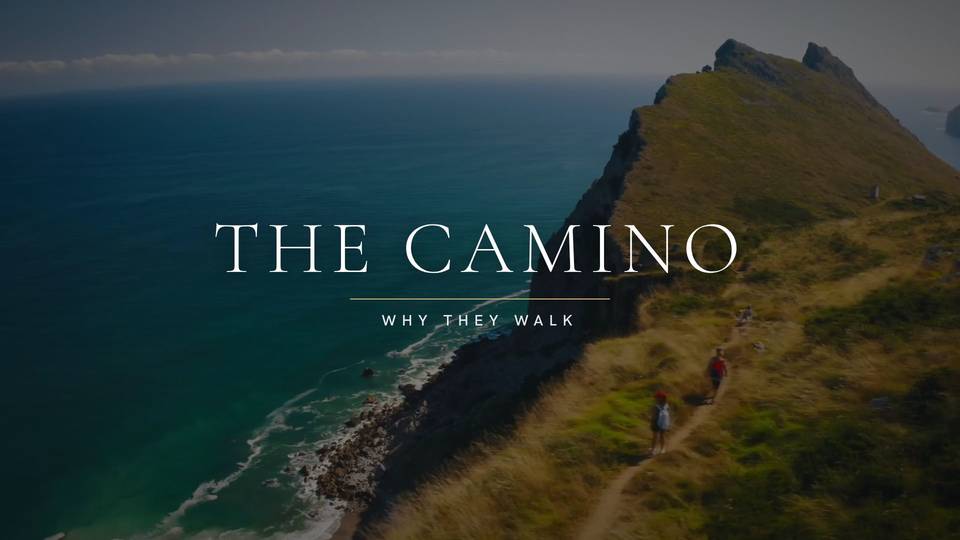Title card reading The Camino, Why They Walk, over an aerial view of a green headland meeting the sea
