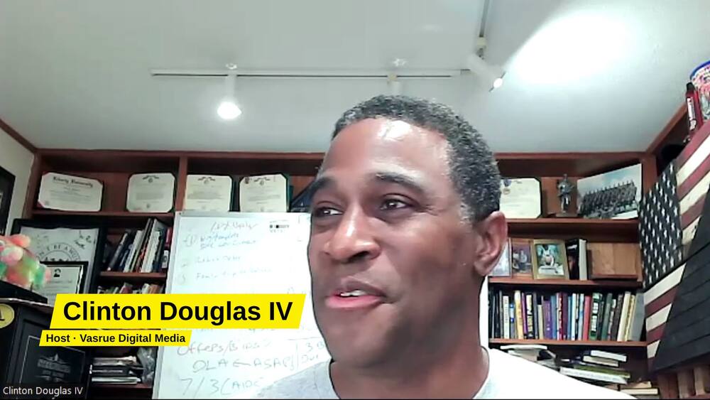 Clinton Douglas IV smiling, with his name tag reading Host, Vasrue Digital Media.