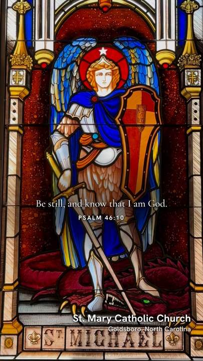 Psalm 46:10, Be still and know that I am God, over the St. Michael window